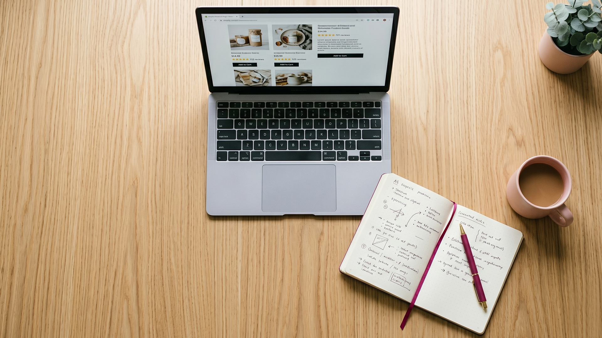 Laptop on a clean desk showing a Shopify product page with star ratings, comparison notes alongside