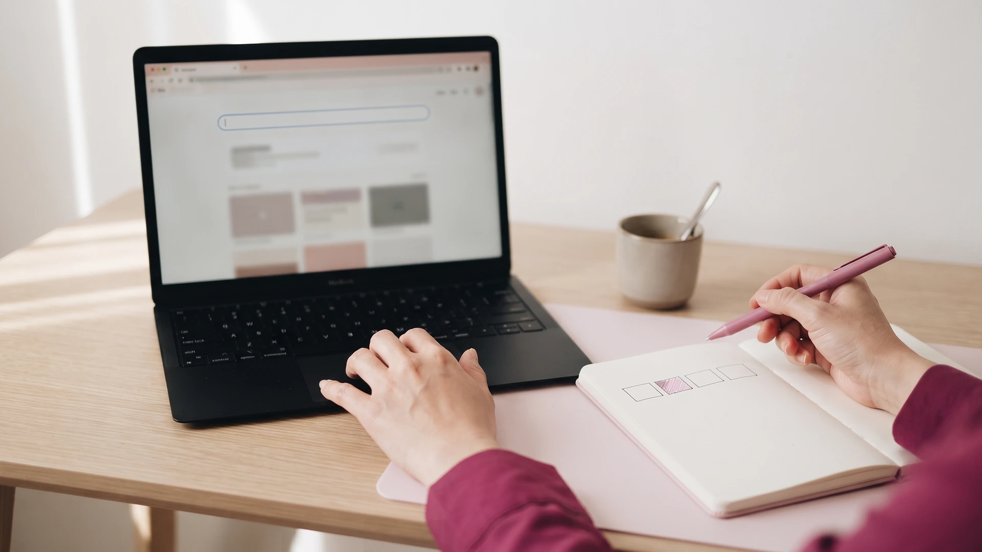 Hands on a laptop beside an open notebook, planning how to remove /blogs/ from a Shopify URL