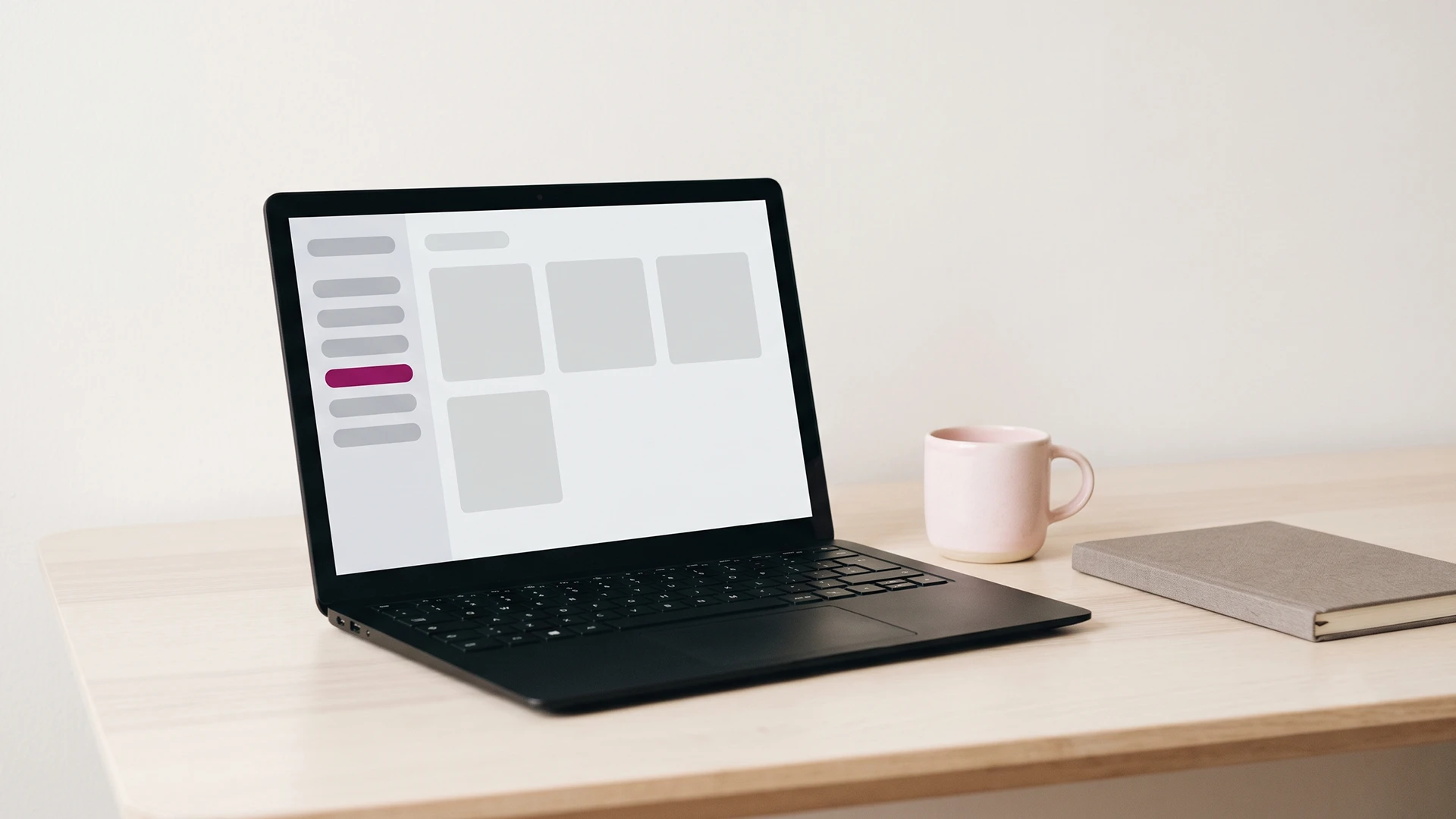 Laptop on a calm desk showing a Shopify admin sidebar with a new agentic sales channel